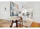 Dining area with modern table and chairs, flowing into a well-lit kitchen at 5014 Marshfield Rd # 30, Sarasota, FL 34235