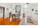 Charming dining area complemented by hardwood floors and an adjacent entry way at 5014 Marshfield Rd # 30, Sarasota, FL 34235