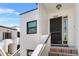Exterior of condo unit with private front door and red brick steps at 5014 Marshfield Rd # 30, Sarasota, FL 34235