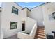 Exterior of condo unit with private front door and red brick steps at 5014 Marshfield Rd # 30, Sarasota, FL 34235
