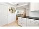 View from the kitchen looking out to the living room showcasing modern open concept living at 5014 Marshfield Rd # 30, Sarasota, FL 34235