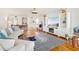 Cozy living room featuring hardwood floors, a nautical striped rug and a large entertainment center at 5014 Marshfield Rd # 30, Sarasota, FL 34235
