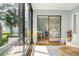 Sunroom with sliding glass doors leading outside with office and bedroom views at 5014 Marshfield Rd # 30, Sarasota, FL 34235