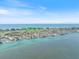 Stunning aerial view of waterfront homes on canals near ocean and golf course in beautiful coastal community at 524 Schooner Ln, Longboat Key, FL 34228