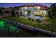 Beautiful backyard with swimming pool, spa, and private boat dock on waterfront property at 524 Schooner Ln, Longboat Key, FL 34228