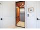 Home elevator with wood interior, grid ceiling, and safety gate for easy multi-floor access at 524 Schooner Ln, Longboat Key, FL 34228