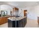 Spacious kitchen with a large center island, custom cabinetry, and stainless steel appliances at 524 Schooner Ln, Longboat Key, FL 34228