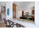 Open kitchen with granite countertops, island, and bar seating at 524 Schooner Ln, Longboat Key, FL 34228