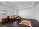 Spacious living room with hardwood floors, decorative ceiling, and modern furnishings and neutral color palette at 524 Schooner Ln, Longboat Key, FL 34228