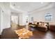 Spacious living room with hardwood floors, decorative ceiling, and modern furnishings and neutral color palette at 524 Schooner Ln, Longboat Key, FL 34228