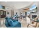 Bright living room featuring tile floors, fireplace, and views of the outdoor patio at 524 Schooner Ln, Longboat Key, FL 34228