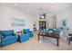 Bright and airy living room features tile flooring, comfortable seating, and tasteful decor at 524 Schooner Ln, Longboat Key, FL 34228