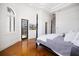 Bright main bedroom with hardwood floors and a four-poster bed at 524 Schooner Ln, Longboat Key, FL 34228