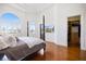 Light-filled main bedroom featuring wood floors and walk-in closet at 524 Schooner Ln, Longboat Key, FL 34228