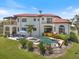 Backyard oasis featuring a swimming pool, spa, patio, and lush landscaping, perfect for outdoor entertaining at 524 Schooner Ln, Longboat Key, FL 34228