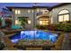Stunning pool with raised hot tub and custom patio area, perfect for enjoying evening swims at 524 Schooner Ln, Longboat Key, FL 34228