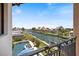 Backyard canal view with private pool and a boat dock at 524 Schooner Ln, Longboat Key, FL 34228