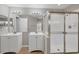 Updated bathroom with dual sinks, a large mirror and a glass enclosed shower at 5642 29Th Street E Cir, Bradenton, FL 34203