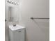 Bright bathroom with a white single sink vanity, a large mirror, and modern lighting at 5642 29Th Street E Cir, Bradenton, FL 34203