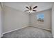 Bedroom with carpeting, a ceiling fan, and a window at 5642 29Th Street E Cir, Bradenton, FL 34203