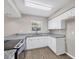 Updated kitchen with granite countertops, stainless steel appliances, and vinyl plank flooring at 5642 29Th Street E Cir, Bradenton, FL 34203