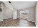 Cozy living room featuring vinyl plank flooring and an archway; staircase nearby at 5642 29Th Street E Cir, Bradenton, FL 34203