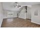 Open living area with high ceilings, vinyl floors, and a staircase leading to the second floor at 5642 29Th Street E Cir, Bradenton, FL 34203