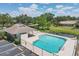 Stunning community pool area with comfortable lounge chairs, a shade pavilion, and ample parking at 5642 29Th Street E Cir, Bradenton, FL 34203