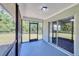 Comfortable screened-in patio, great for outdoor dining, with access to the backyard and living room at 5642 29Th Street E Cir, Bradenton, FL 34203