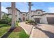 Beautiful home exterior showcasing a brick driveway, lush landscaping, and elegant architectural details at 5830 Jamila River Dr, Venice, FL 34293