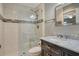 Stylish bathroom with walk-in shower, modern fixtures, and marble countertop vanity at 6007 Vivienda Dr # 29, Bradenton, FL 34207