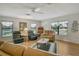 Cozy living room with hardwood floors, neutral walls, and comfortable seating arrangement at 6007 Vivienda Dr # 29, Bradenton, FL 34207