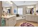 Bright bathroom with tile floors, dual sink vanity, soaking tub, and neutral wall color at 6101 34Th W St # 9C, Bradenton, FL 34210