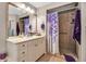 Bathroom featuring a shower, vanity with framed mirror, towels, and decor at 6101 34Th W St # 9C, Bradenton, FL 34210