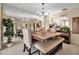 Elegant dining room featuring a modern table set and mirrored wall, creating an inviting space at 6101 34Th W St # 9C, Bradenton, FL 34210