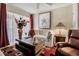 Cozy living room with comfortable seating, a ceiling fan, and a large window with vertical blinds at 6101 34Th W St # 9C, Bradenton, FL 34210