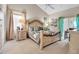 Spacious main bedroom with a decorative bed frame, neutral tones, and an abundance of natural light at 6101 34Th W St # 9C, Bradenton, FL 34210