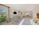 Well-lit main bedroom featuring a wall mounted television and calming decor for optimal rest at 642 S Owl Dr, Sarasota, FL 34236