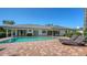 Backyard pool with brick patio, lounge chairs, and lush landscaping offers a serene outdoor retreat at 642 S Owl Dr, Sarasota, FL 34236