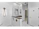 Bright bathroom featuring a glass shower, modern fixtures, and white marble patterned tile at 6532 Copper Ridge Trl, Bradenton, FL 34201