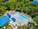 Community pool with lounge chairs and shaded areas for residents to enjoy at 6532 Copper Ridge Trl, Bradenton, FL 34201