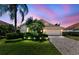 Well-maintained single-Gathering home with a manicured lawn, tropical landscaping, and a two-car garage at 6532 Copper Ridge Trl, Bradenton, FL 34201