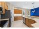 Eat-in kitchen featuring wooden cabinets and stainless steel appliances at 6532 Copper Ridge Trl, Bradenton, FL 34201