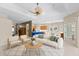 Open-concept living room features modern furniture, ceiling fan, and a combined living/dining area at 6532 Copper Ridge Trl, Bradenton, FL 34201