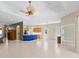 Open-concept living room featuring high ceilings and tile flooring at 6532 Copper Ridge Trl, Bradenton, FL 34201