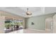 Open living space showcasing a ceiling fan, sliding glass doors and access to the backyard patio at 6532 Copper Ridge Trl, Bradenton, FL 34201
