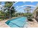 Screened in swimming pool with brick patio and lush landscaping at 6532 Copper Ridge Trl, Bradenton, FL 34201