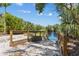 Easy water access via the boat launch, with a wooden rail and crushed shells at 6532 Copper Ridge Trl, Bradenton, FL 34201
