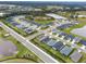 A high-angle view of a neatly arranged neighborhood, complete with serene ponds and lush greenery at 6708 162Nd E Pl, Parrish, FL 34219