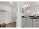 Bathroom view includes a vanity with a dark countertop and a walk-in closet at 6708 162Nd E Pl, Parrish, FL 34219